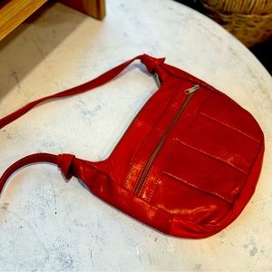 Vintage shoulder purse with long strap.